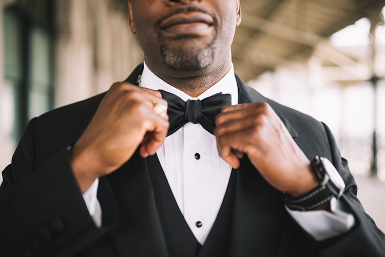 Groom Adjusting Bowtie | Should the Groom Wear a Suit or a Tuxedo? | Details Nashville | The Pink Bride® www.thepinkbride.com